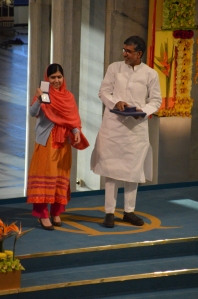 Kailash Satyarthi and Malala Yousafzai with Nobel Peace Prize Diplomas.